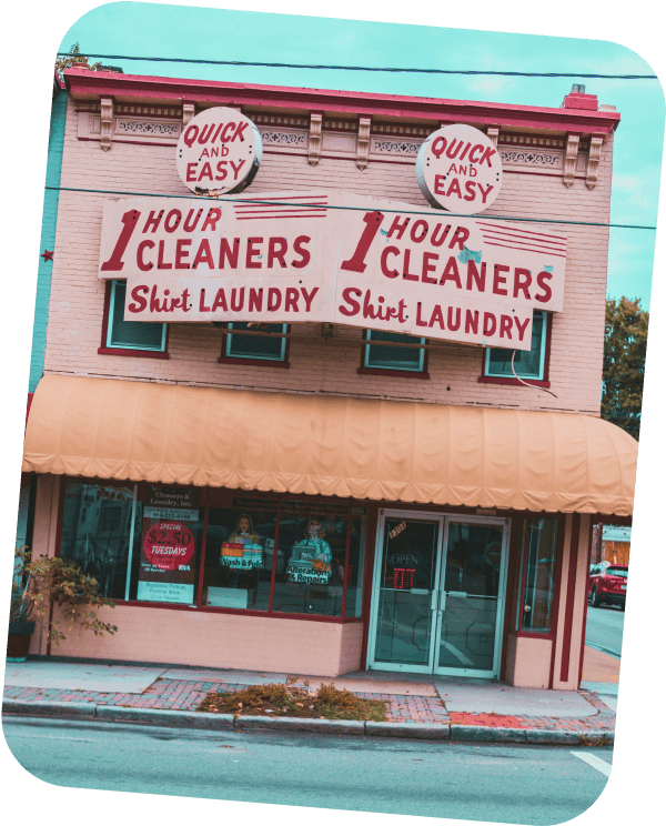 After Image, clear and sharp storefront of a dry cleaning service with visible text on the signs